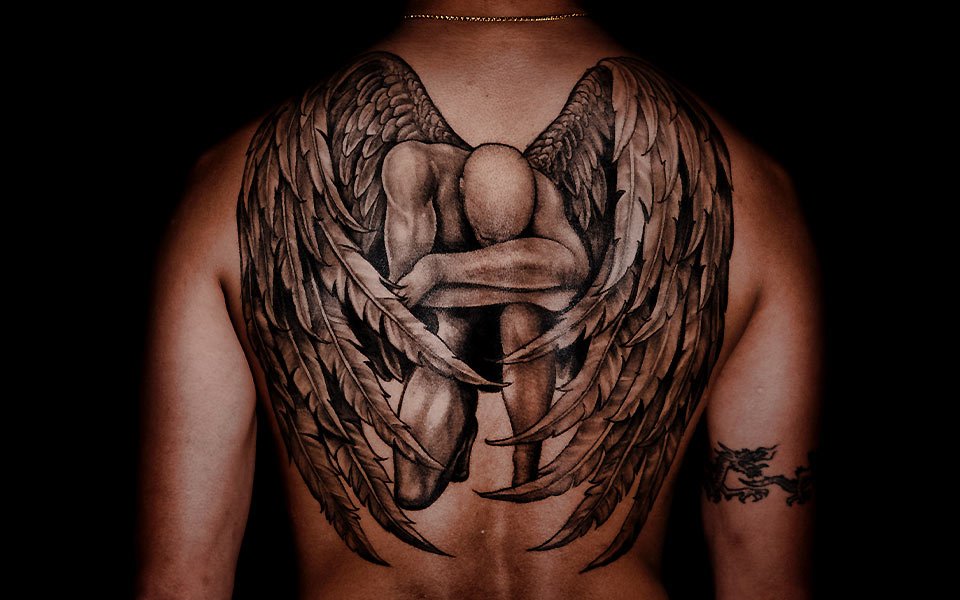 Man with Tattoo on Back Man with Tattoo on Back