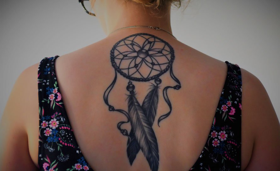 Woman with Tattoo on her Back Woman with Tattoo on her Back